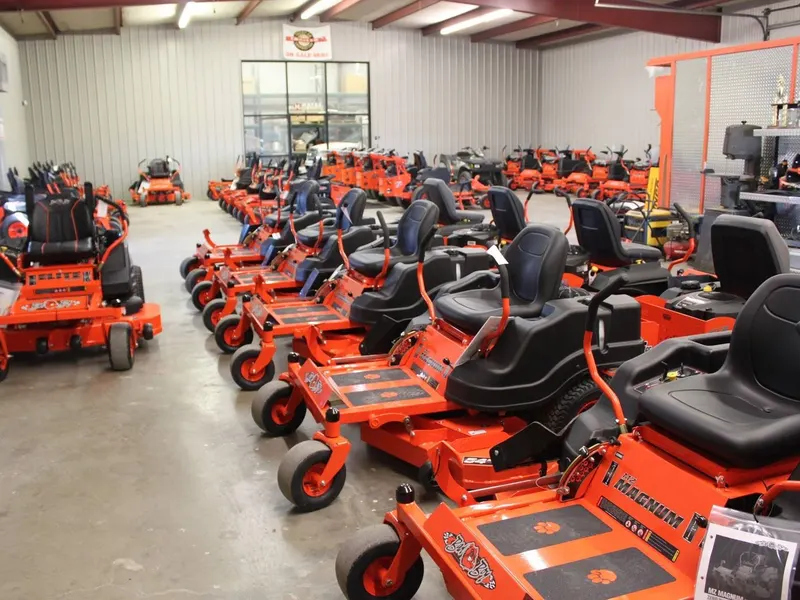 Rows of Bad Boy MZ Magnum zero turn mowers inside the Hayes Equipment showroom