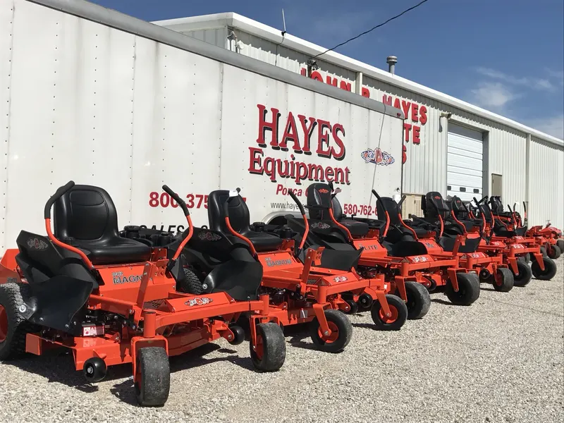 Hayes Equipment trailer and Bad Boy MZ Magnum mowers in front of the John B. Hayes Real Estate and Auction building