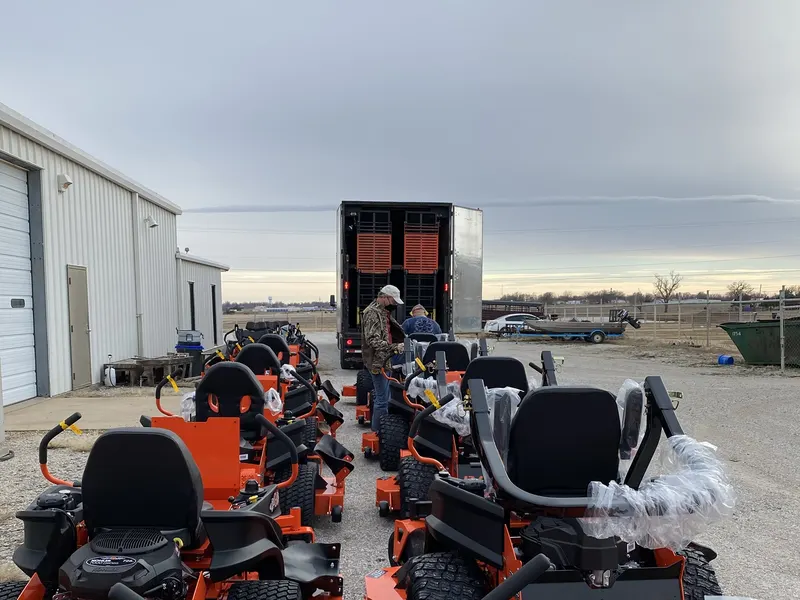Unloading a semi trailer of new Bad Boy mowers at Hayes Equipment in Ponca City